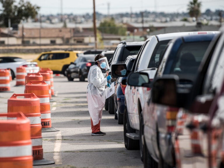 El Paso Imposes New Lockdown Measures As Coronavirus Infections Soar Coronavirus test line in Texas