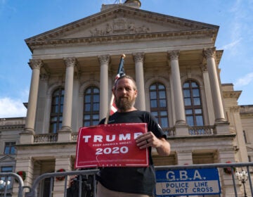 Supporters of Donald Trump host a 'Stop the Steal' protest outside of the Georgia State Capital
