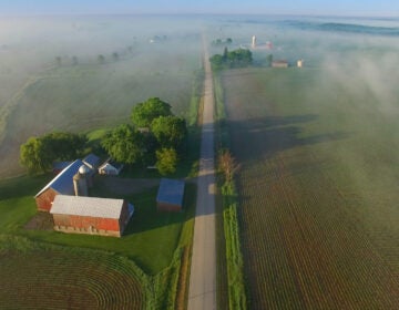 Perfectly scenic aerial view of rural Wisconsin on a foggy spring morning.