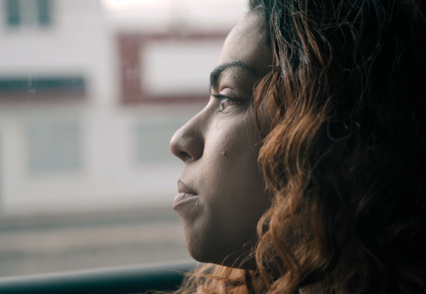 Nani looks out the window during the filming of "Higher Love."