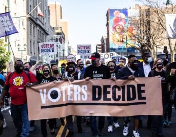 Demonstrators march through Center City