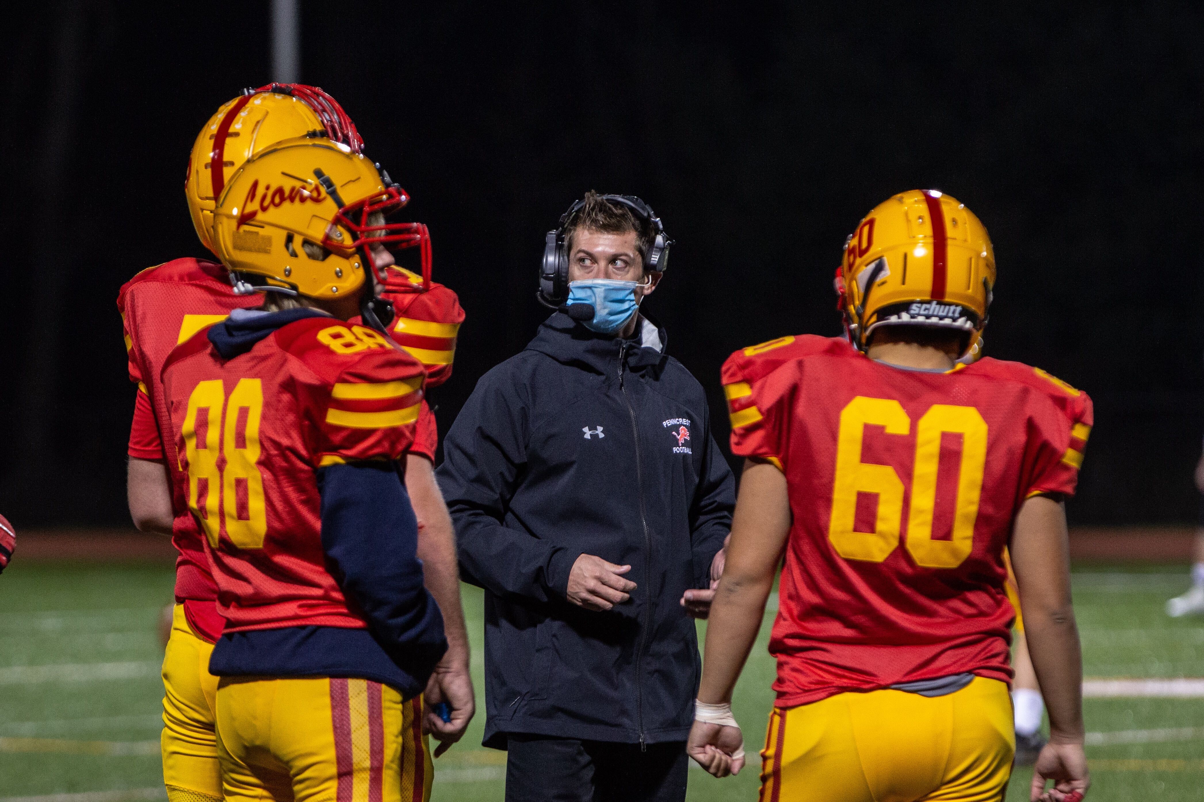 Penncrest High School football coach Ryan Smith talks to players during the Media Bowl Friday.