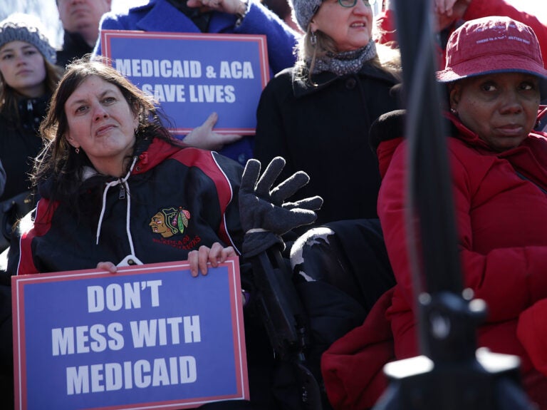 Health care activists rally in front of the U.S. Capitol