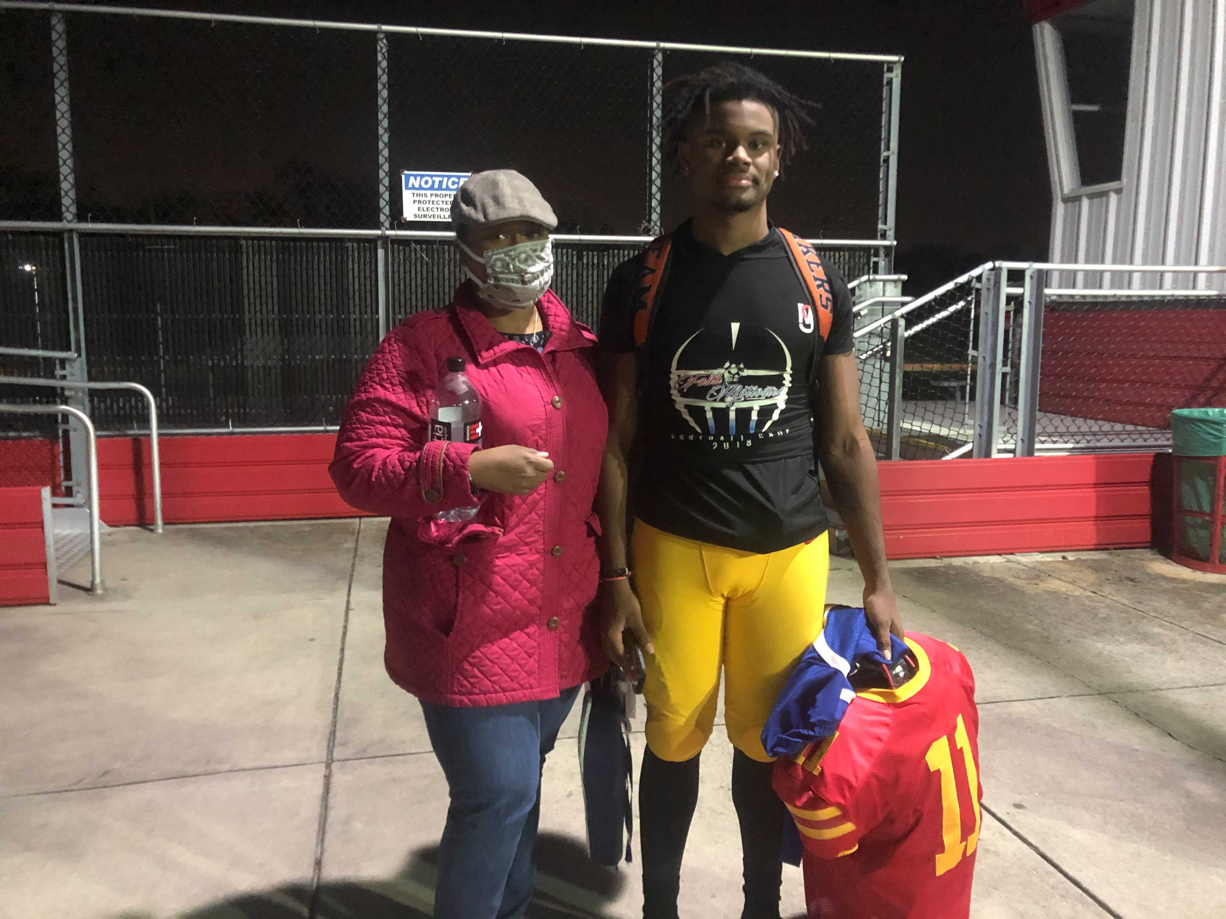 Deveyon Fitzgerald and his mom, Nia, after the 2020 Media Bowl