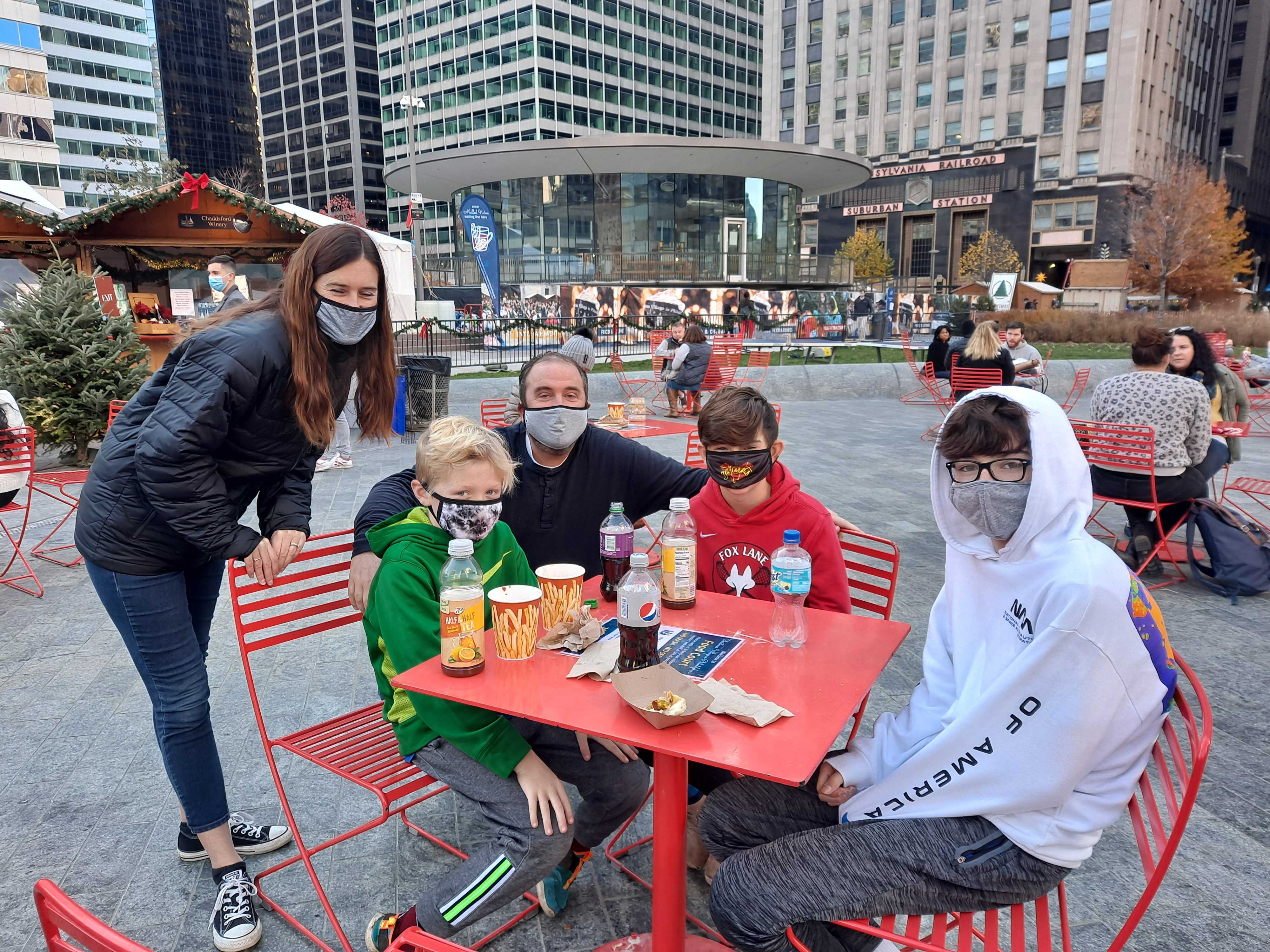 Amy Silvestri and her family get ready to explore the Christmas Village after a quick bite.