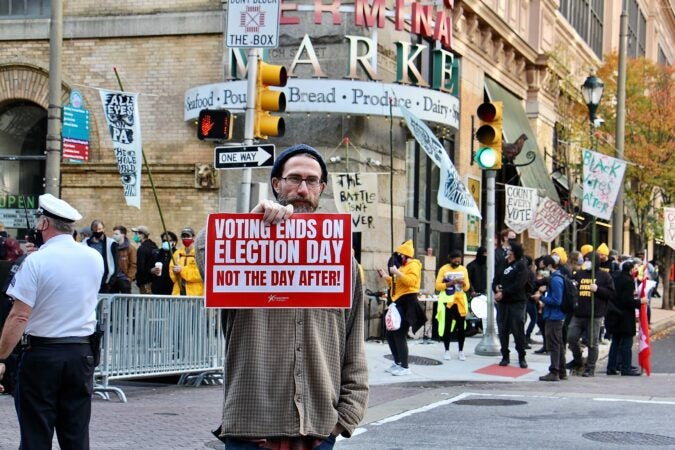 Dan Kelly was one of a handful of protesters who stood in front of the Pennsylvania Convention Center, objecting to the ongoing vote counting happening there.