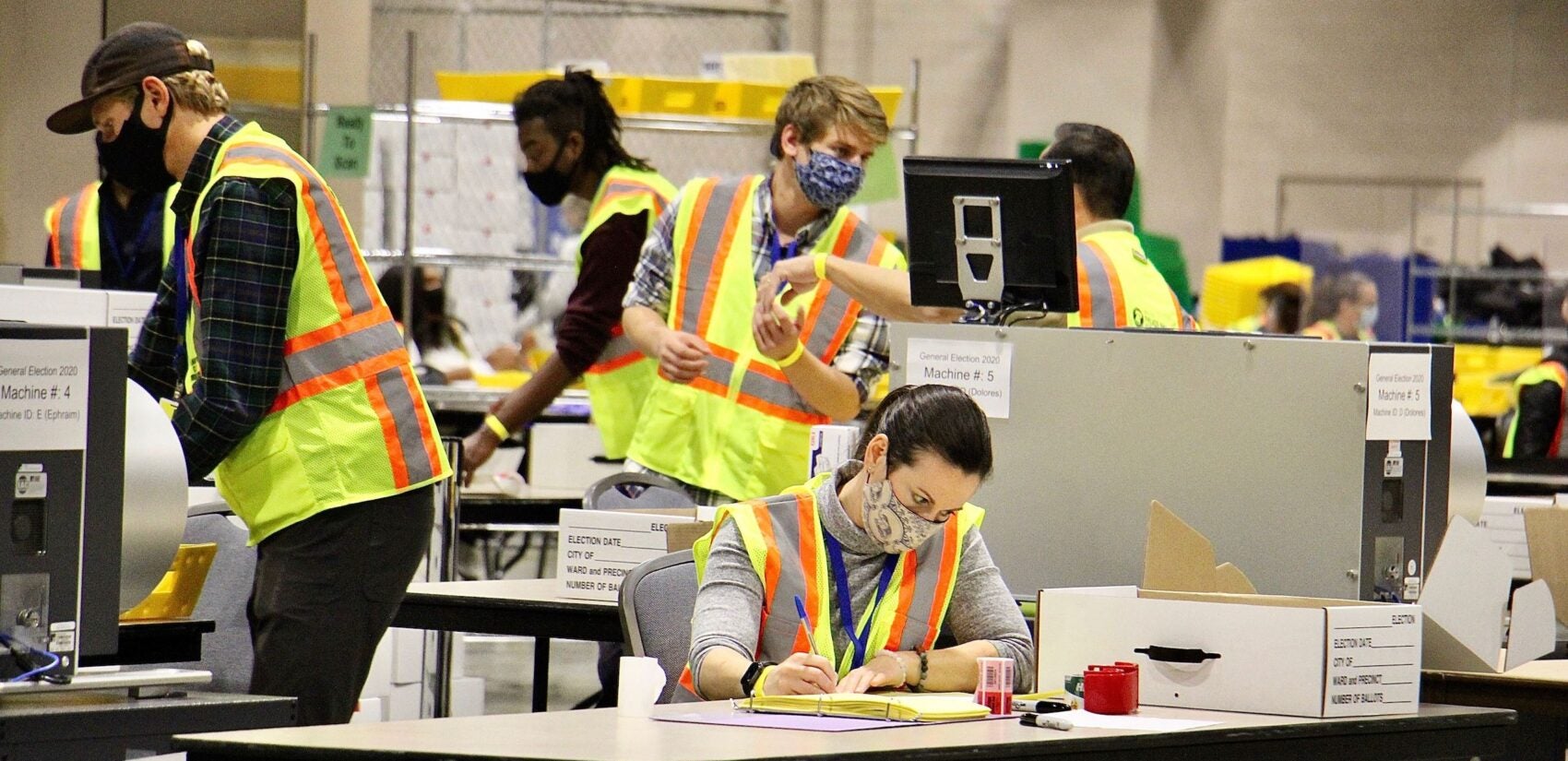 Election workers scan ballots at the Pennsylvania Convention Center.