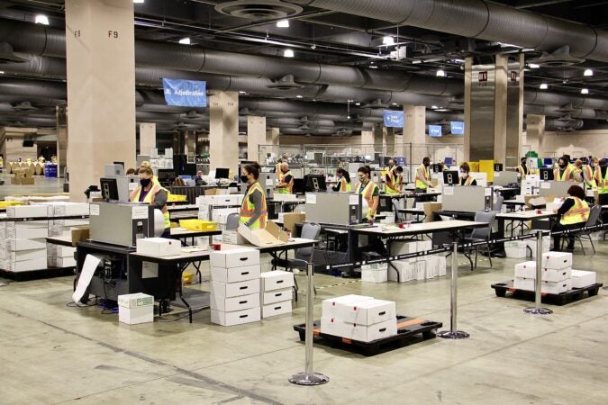 Election workers scan ballots at the Pennsylvania Convention Center. Officials anticipate that the task of scanning mail and absentee ballots will be completed Thursday.