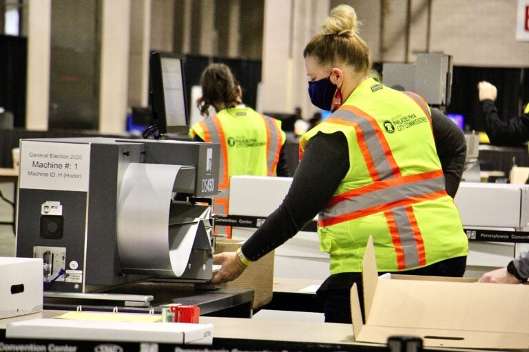 Election workers scan ballots at the Pennsylvania Convention Center. Officials anticipate that the task of scanning mail and absentee ballots will be completed Thursday.
