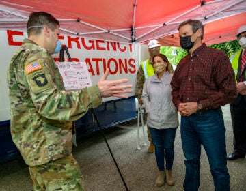 Tennessee Gov. Bill Lee, right, tours a temporary hospital site in April with his wife Maria Lee.