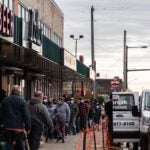 Philadelphians line up outside Izlas restaurant in Kensington for a free Thanksgiving turkey.