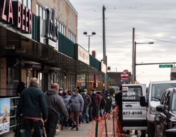 Philadelphians line up outside Izlas restaurant in Kensington for a free Thanksgiving turkey.