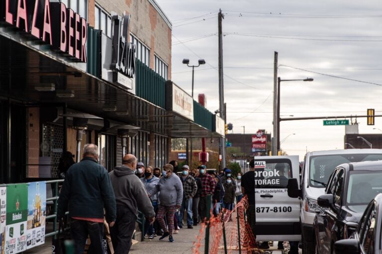 Philadelphians line up outside Izlas restaurant in Kensington for a free Thanksgiving turkey.