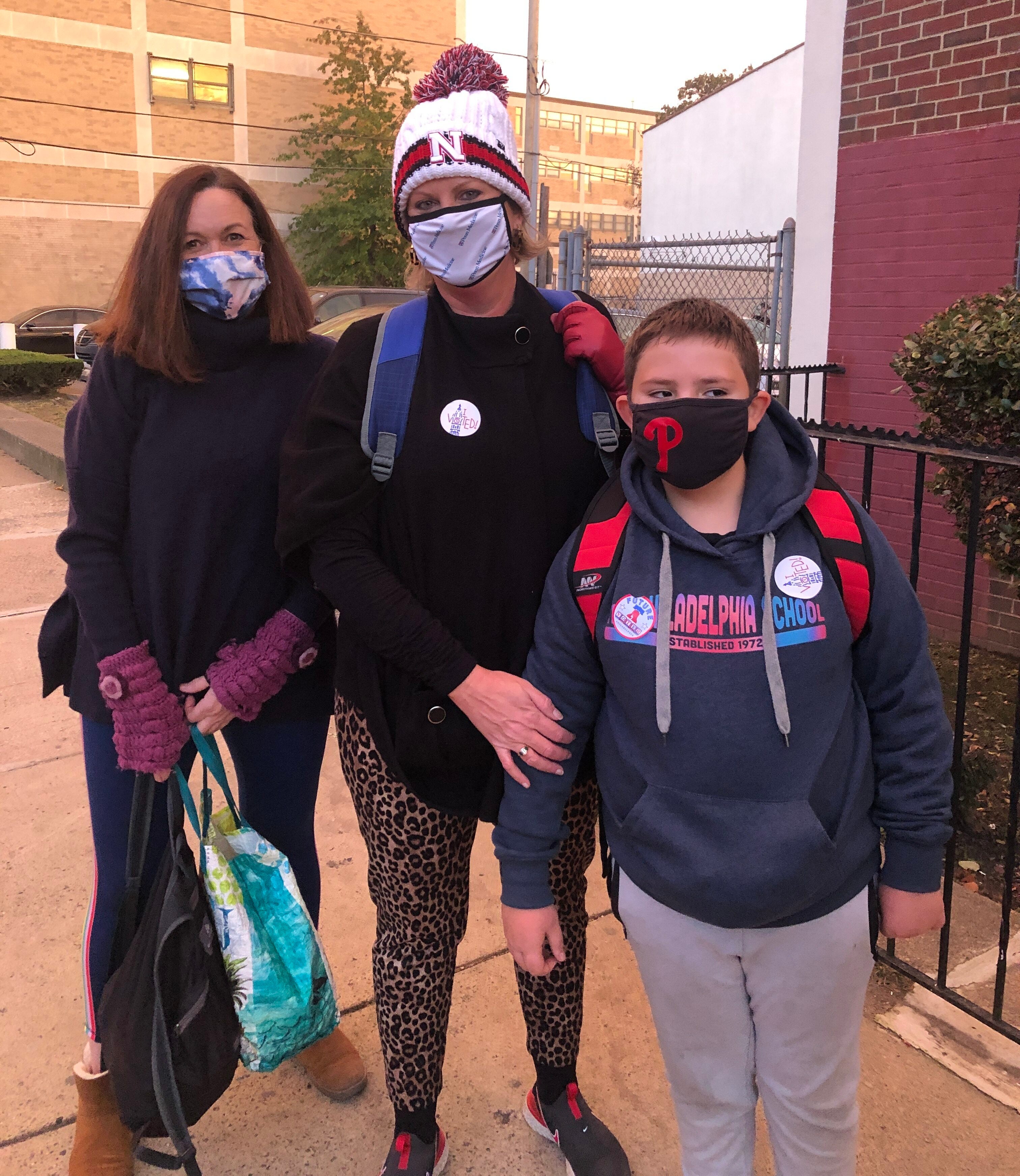 Janice Pfeiffer, Tricia Bruning and her son Carson Butler at a polling place in Brewerytown