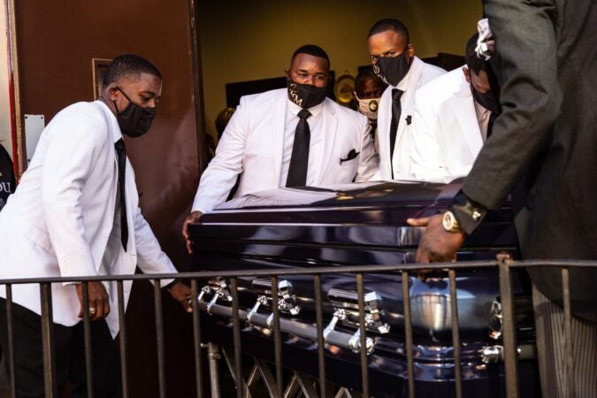 Walter Wallace Jr.’s casket is moved out of New Temple Baptist Church in North Philadelphia.