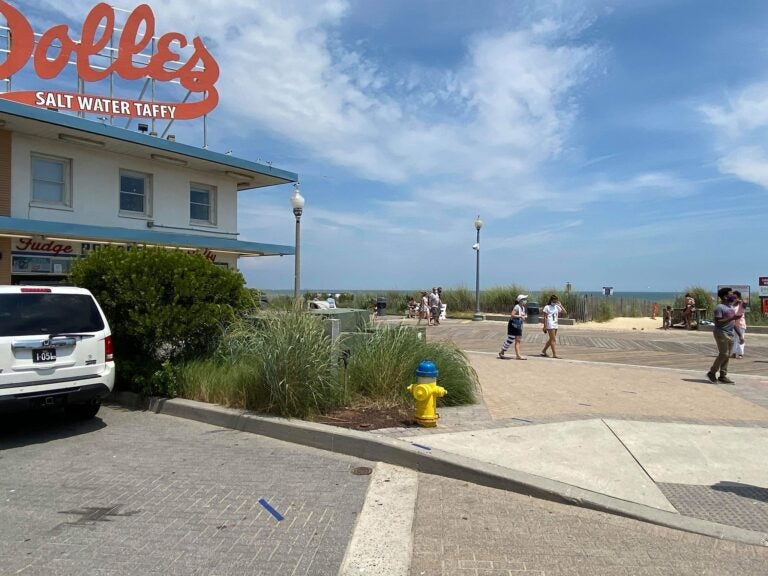 The Dolles sign atop the salt water taffy story has been a landmark in Rehoboth Beach for more than a half-century. (Butch Comegys for WHYY)