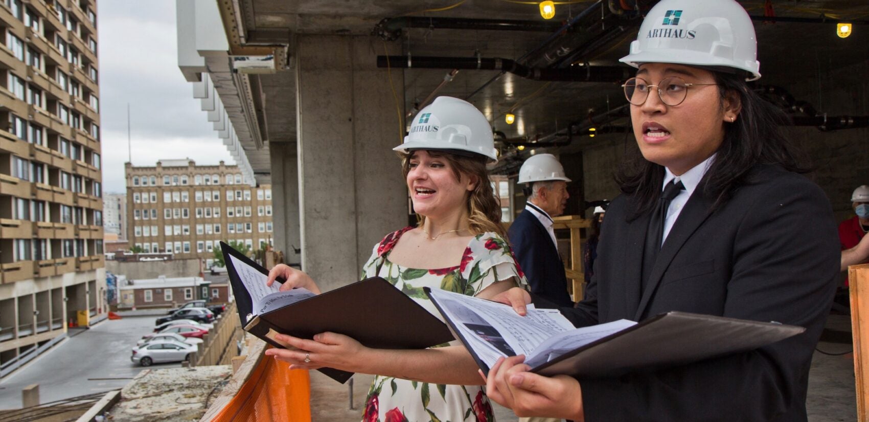 University of the Arts seniors Andrew Malabunga (right) and Miranda Pilato (left) rehearse on the 7th floor of the under-construction Arthaus Condominiums for their Opera on the Avenue performance on Sept. 16, 2020. (Kimberly Paynter/WHYY)