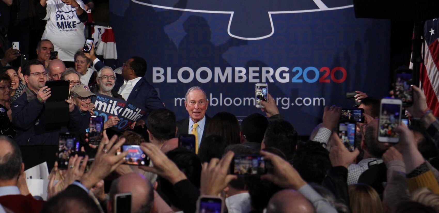 Democratic presidential candidate Michael Bloomberg arrives to a cheering crowd at the National Constitution Center in Philadelphia. (Emma Lee/WHYY)