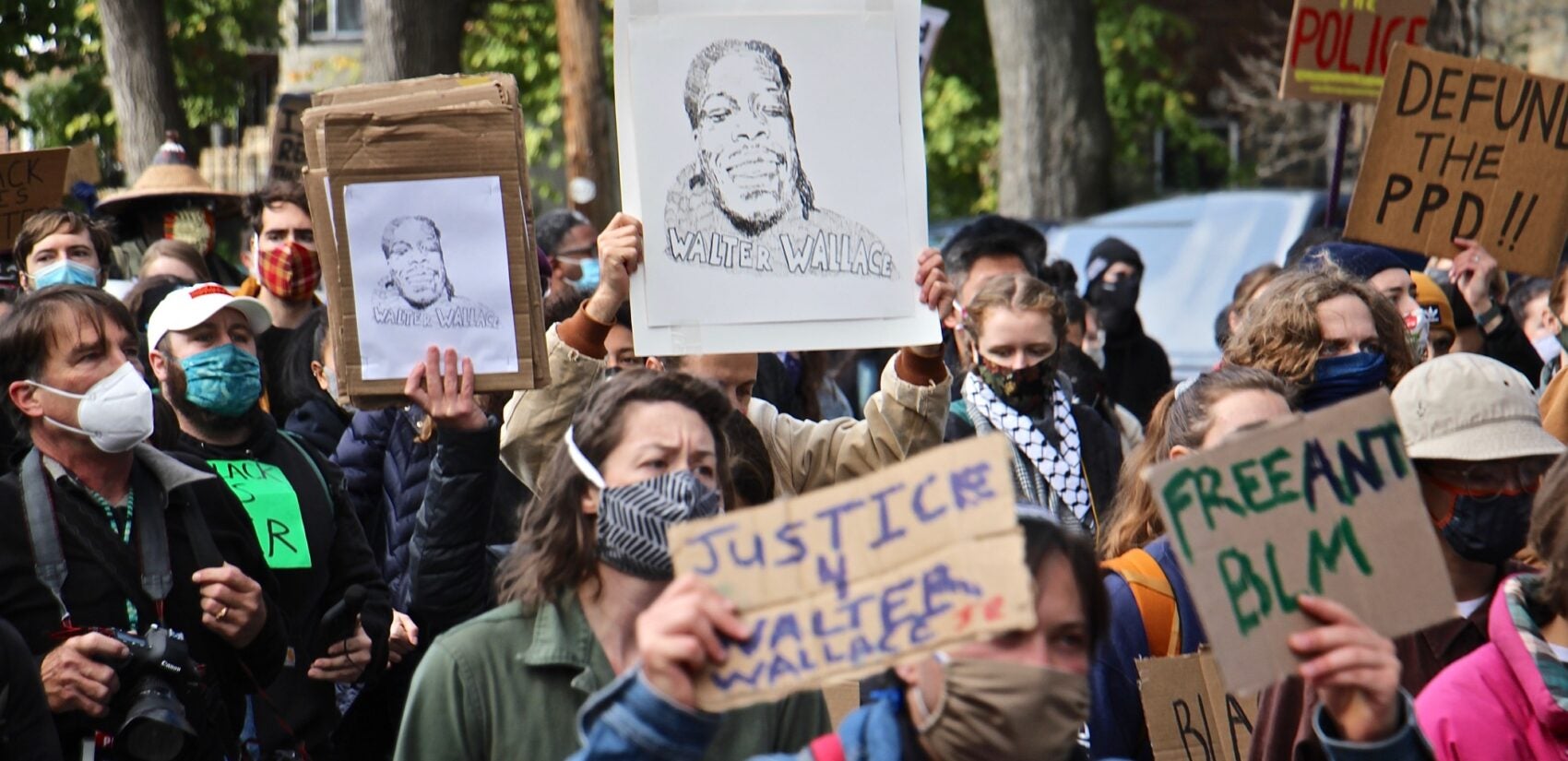 Protesters march from the scene of Walter Wallace Jr.’s killing to Malcolm X Park. (Emma Lee/WHYY)