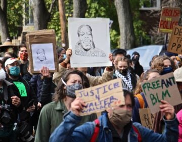 Protesters march from the scene of Walter Wallace Jr.’s killing to Malcolm X Park. (Emma Lee/WHYY)