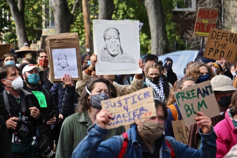 Protesters march from the scene of Walter Wallace Jr.’s killing to Malcolm X Park. (Emma Lee/WHYY)