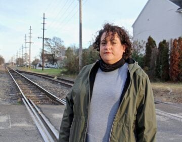 Vanessa Keegan, 41, lives in Gibbstown with her boyfriend and 3-year-old son one block from the railroad tracks that will carry liquid natural gas to an export facility on the Delaware River. (Emma Lee/WHYY)
