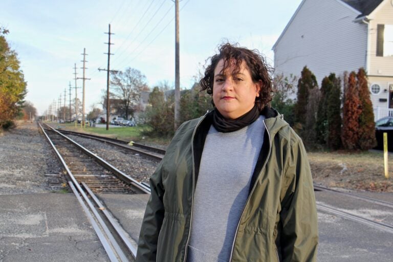 Vanessa Keegan, 41, lives in Gibbstown with her boyfriend and 3-year-old son one block from the railroad tracks that will carry liquid natural gas to an export facility on the Delaware River. (Emma Lee/WHYY)