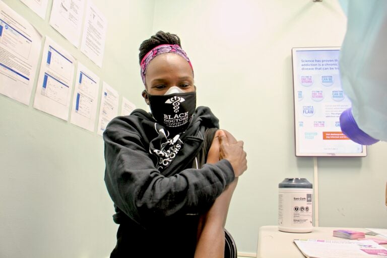 Dr. Ala Stanford gets her COVID-19 vaccination at a Philadelphia Department of Health clinic on Dec. 16, 2020. (Emma Lee/WHYY)