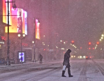 Snow falls on Market Street during a snow storm on December 16, 2020. (Kimberly Paynter/WHYY)