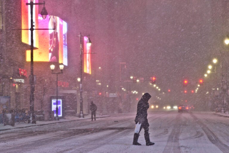 Snow falls on Market Street during a snow storm on December 16, 2020. (Kimberly Paynter/WHYY)