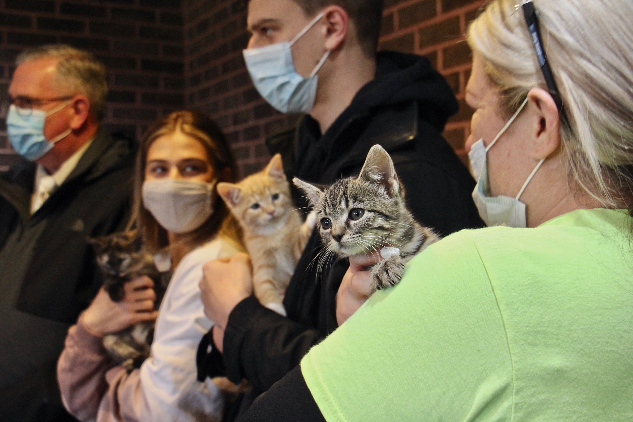 Ashley Bush (right), an employee at the Burlington County recycling plant in Westampton, holds Precious, the kitten she adopted.