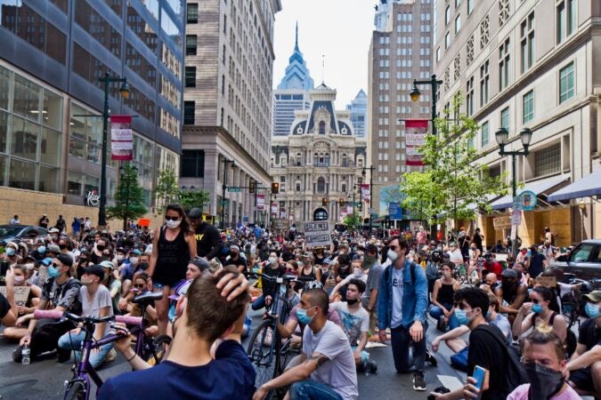 Protesters in Philadelphia took a knee on Market Street on June 4, 2020 in memory of George Floyd. (Kimberly Paynter/WHYY)