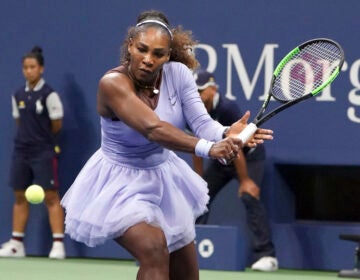 Serena Williams getting ready to hit a tennis ball