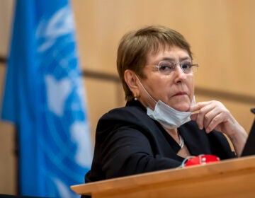 FILE - In this Wednesday, June 17, 2020 file photo the High Commissioner for Human Rights, Michelle Bachelet, attends a meeting of the Human Rights Council of the United Nations in Geneva, Switzerland. The U.N. human rights chief is hailing “some extremely encouraging pledges” from U.S. President-elect Joe Biden, citing his call for efforts to address issues like systemic racism, women’s rights, torture and climate change. (Martial Trezzini/Keystone via AP, file)