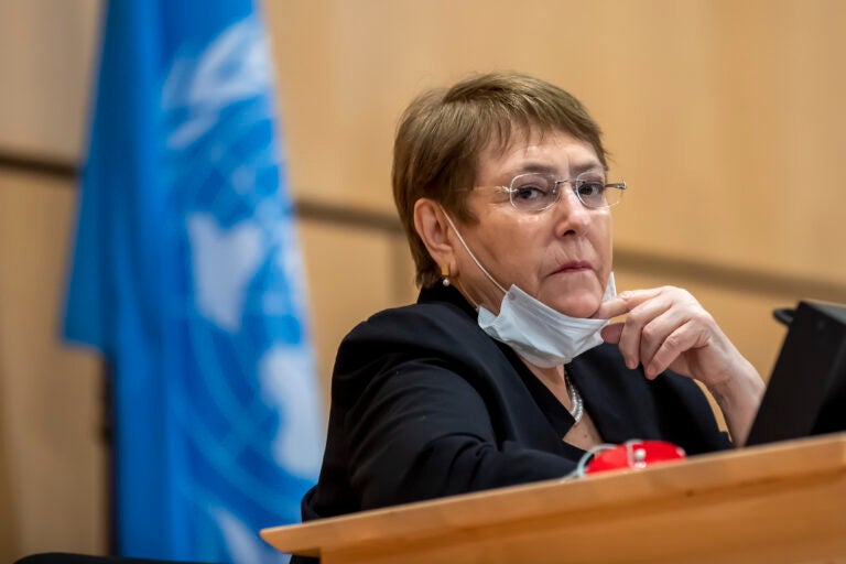 FILE - In this Wednesday, June 17, 2020 file photo the High Commissioner for Human Rights, Michelle Bachelet, attends a meeting of the Human Rights Council of the United Nations in Geneva, Switzerland. The U.N. human rights chief is hailing “some extremely encouraging pledges” from U.S. President-elect Joe Biden, citing his call for efforts to address issues like systemic racism, women’s rights, torture and climate change. (Martial Trezzini/Keystone via AP, file)