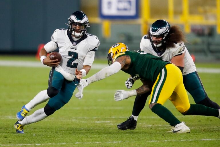 Philadelphia Eagles' Jalen Hurts runs during the second half of an NFL football game against the Green Bay Packers Sunday, Dec. 6, 2020, in Green Bay, Wis. The Packers won 30-16. (AP Photo/Matt Ludtke)