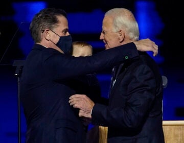 President-elect Joe Biden, right, embraces his son Hunter Biden, left, Saturday, Nov. 7, 2020, in Wilmington, Del. (AP Photo/Andrew Harnik, Pool)