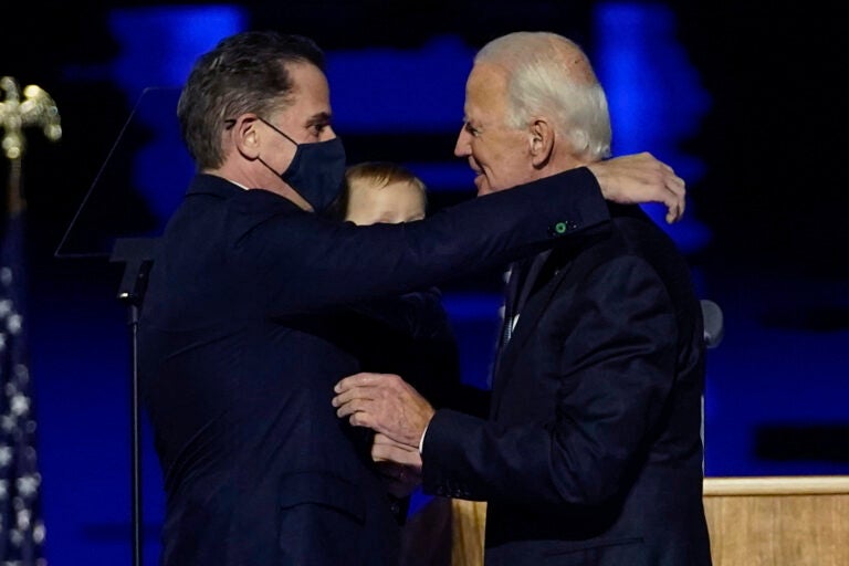 President-elect Joe Biden, right, embraces his son Hunter Biden, left, Saturday, Nov. 7, 2020, in Wilmington, Del. (AP Photo/Andrew Harnik, Pool)