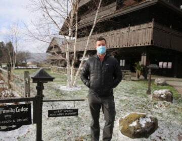 Bob Schwartz, the director of marketing of the Trapp Family Lodge poses outside the lodge on Tuesday, Dec. 15, 2020 in Stowe, Vt. (AP Photo/Wilson Ring)