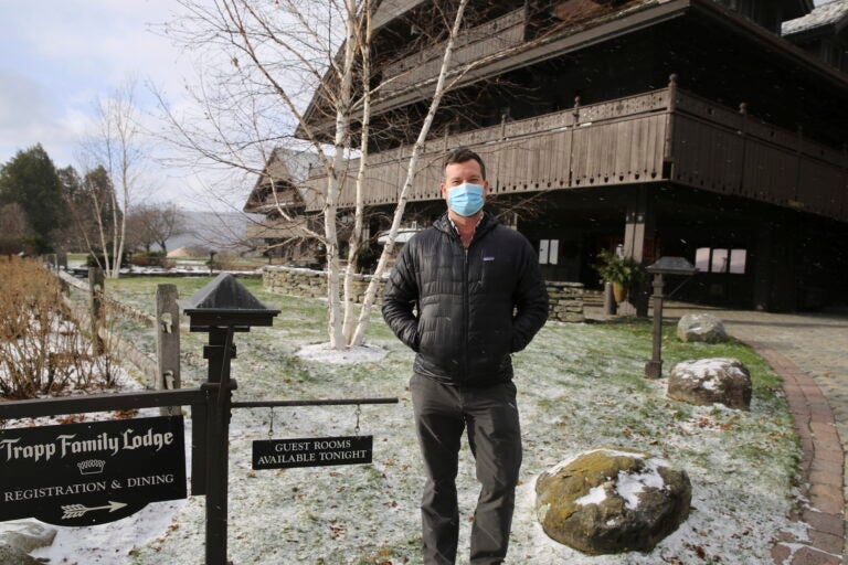 Bob Schwartz, the director of marketing of the Trapp Family Lodge poses outside the lodge on Tuesday, Dec. 15, 2020 in Stowe, Vt. (AP Photo/Wilson Ring)