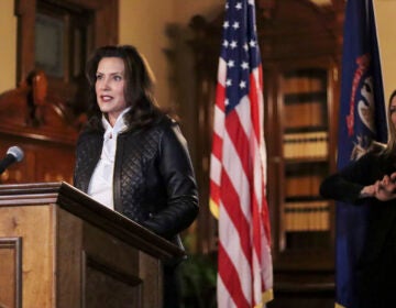 FILE - In this Oct. 8, 2020 file photo provided by the Michigan Office of the Governor, Michigan Gov. Gretchen Whitmer addresses the state during a speech in Lansing, Mich. In an indictment released Thursday, Dec. 17, a federal grand jury charged six men with conspiring to kidnap Whitmer in what investigators say was a plot by anti-government extremists angry over her policies to prevent the spread of the coronavirus. (Michigan Office of the Governor via AP, File)