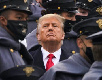 Surrounded by Army cadets, President Donald Trump watches the first half of the 121st Army-Navy Football Game in Michie Stadium at the United States Military Academy, Saturday, Dec. 12, 2020, in West Point, N.Y. (AP Photo/Andrew Harnik)