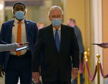 Senate Majority Leader Mitch McConnell of Ky., walks past reporters on Capitol Hill in Washington, Tuesday, Dec. 15, 2020. (AP Photo/Susan Walsh)