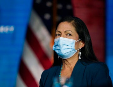 Rep. Deb Haaland, D-N.M., listens as President-elect Joe Biden announces her as his nominee for Secretary of Interior at The Queen Theater in Wilmington Del., Saturday, Dec. 19, 2020. (AP Photo/Carolyn Kaster)