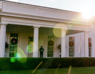 A Marine stands outside the entrance to the West Wing of the White House, signifying the President is in the Oval Office, Tuesday, Dec. 22, 2020, in Washington. (AP Photo/Andrew Harnik)