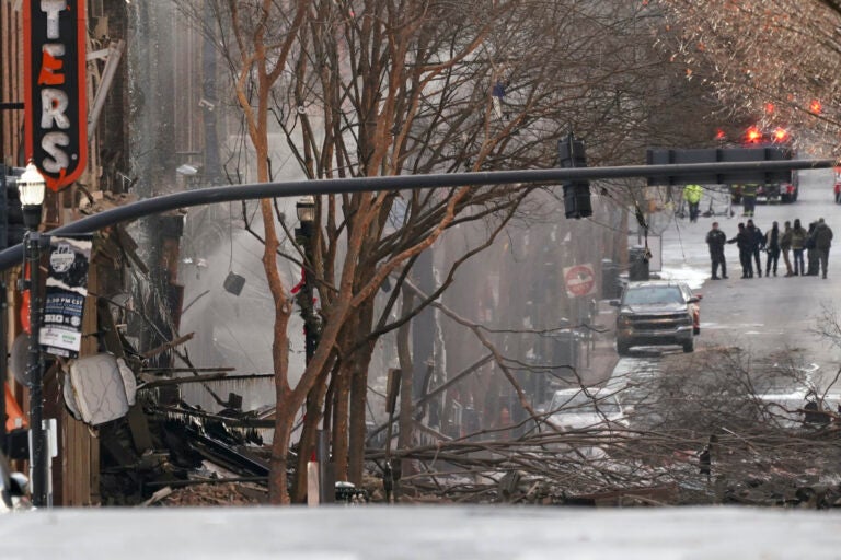 Emergency personnel work at the scene of an explosion in downtown Nashville, Tenn., Friday, Dec. 25, 2020. Buildings shook in the immediate area and beyond after a loud boom was heard early Christmas morning. (AP Photo/Mark Humphrey)