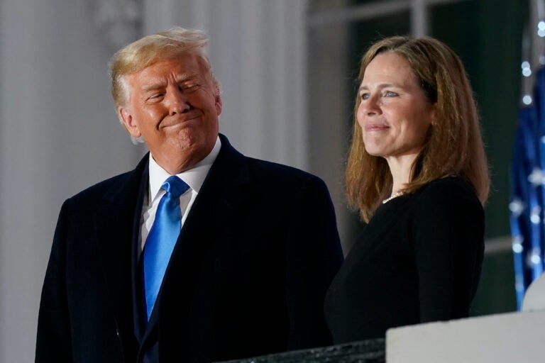 In this Monday, Oct. 26, 2020 file photo, President Donald Trump and Amy Coney Barrett stand on the Blue Room Balcony after Supreme Court Justice Clarence Thomas administered the Constitutional Oath to her on the South Lawn of the White House White House in Washington. (AP Photo/Patrick Semansky)