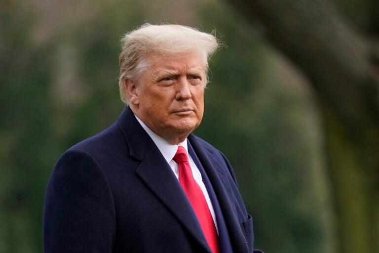 FILE - In this Dec. 12, 2020, file photo President Donald Trump walks on the South Lawn of the White House in Washington before boarding Marine One. Unemployment benefits for millions of Americans struggling to make ends meet were set to lapse at midnight Saturday night unless Trump signed an end-of-year COVID relief and spending bill that had been considered a done deal before his sudden objections. (AP Photo/Patrick Semansky, File)