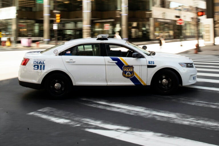 A police officer drives in Philadelphia