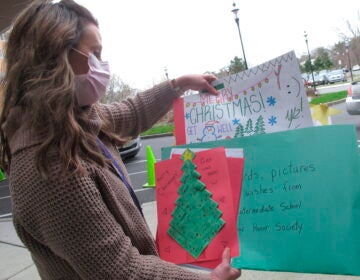 Kathleen Schallus sorts through holiday cards sent to Shore Medical Center